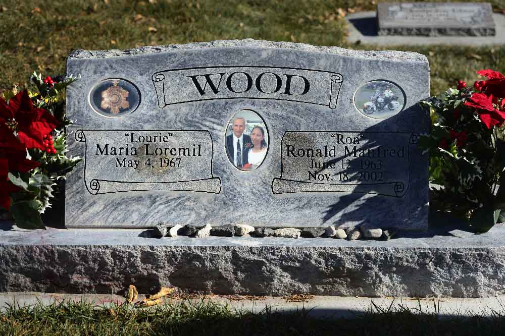 The gravestone of Ron Wood shows a picture of him with Lourie as well as her name and birth date indicating her plot will be next to his
