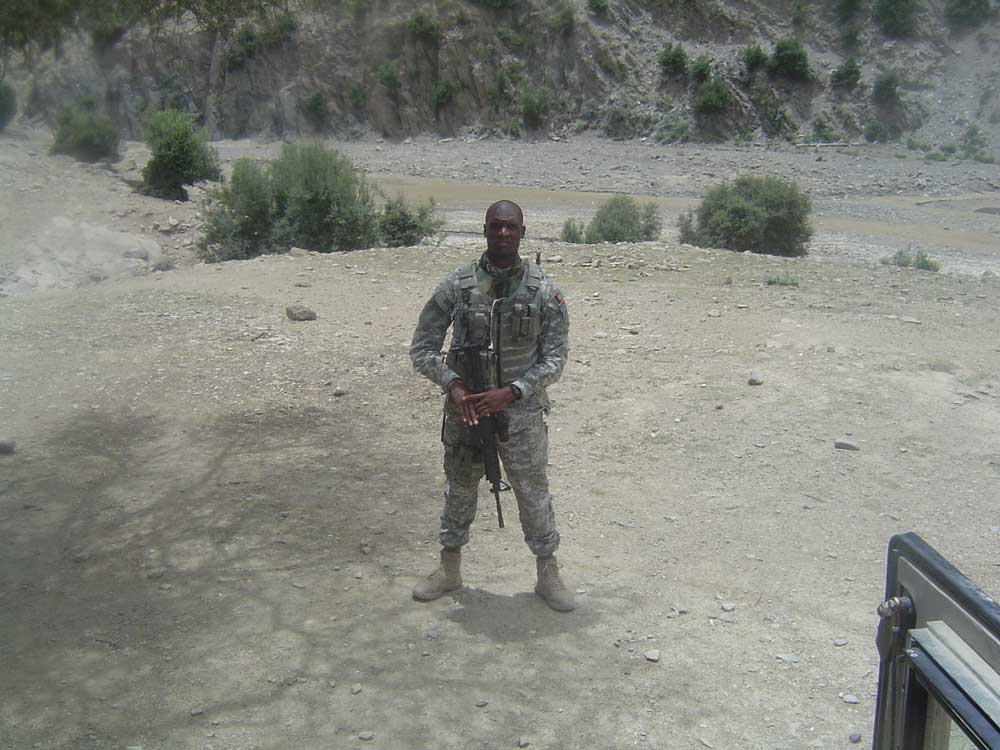 Mike Valdes in his military fatigues in the desert